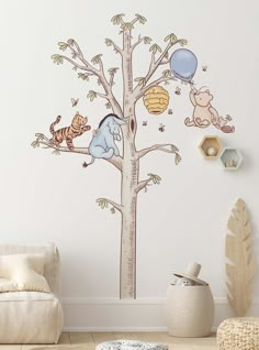 the winnie the pooh tree wall decal is shown