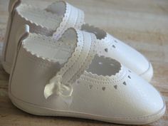 "These baby girl shoes are 100% handmade in Europe with vegan leather so they will are soft and light for your baby's tiny toes. Our baby shoes are available in the following sizes and colors; 0 - 3 months / 3.9\" 3 - 6 months / 4.3\" 6 - 9 months / 4.7\" 9 - 18 months / 5.1\" Available colors: ivory and white. All my works are very well designed and hand crafted of European quality fabrics. Made to order, ready to ship within 3-5 business days. If you have any questions, I would be happy to hel White Shoes For Girls, Baby Gril, Christening Shoes, Handmade Baby Shoes, Shoes Handmade, Leather Baby, Slippers For Girls, Crib Shoes, Shoes Baby