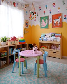 a child's playroom with toys and bookshelves