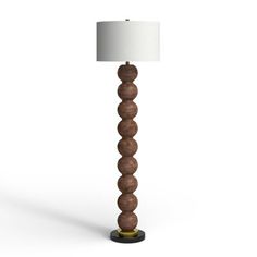 a wooden lamp with a white shade on it's base and a black base