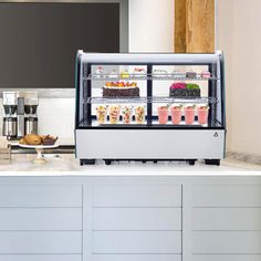 a refrigerated display case sitting on top of a counter