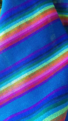 a close up view of a multicolored knitted blanket