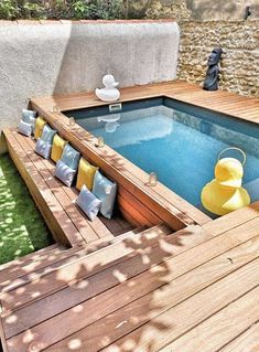 an outdoor hot tub surrounded by wooden decking