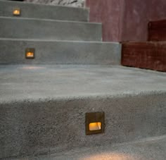 some concrete steps with lights on them