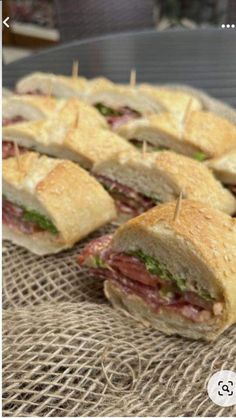 a bunch of sandwiches sitting on top of a table