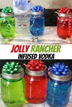 four jars filled with different colored items on top of a marble countertop and the words, jolly rancher infused vodka