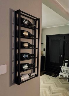 a wine rack is mounted to the wall