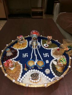 an elaborately decorated tray on a wooden table