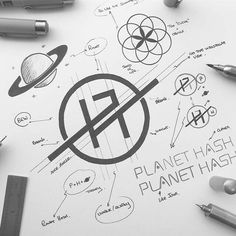 a pen and some pens on top of a sheet of paper with the word planet hash written