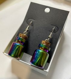 Small iridescent cork bottle earrings. Lightweight. Nickel free! Cork Bottle, Bottle Earrings, Etsy Earrings Dangle, Jewelry Earrings Dangle, Cork, Dangle Drop Earrings, Dangle Earrings, Etsy Accessories, Jewelry Earrings