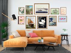 a living room with orange couches and pictures on the wall above it's coffee table