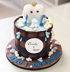 a birthday cake with a tooth on top