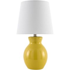 a yellow table lamp with a white shade