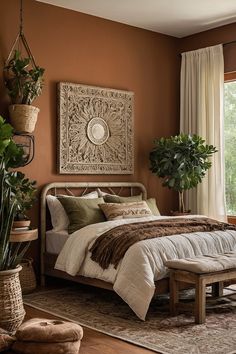 a bedroom with a large bed and potted plants