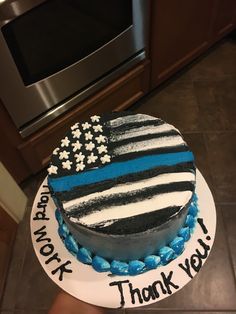 a cake decorated with an american flag and the words thank you