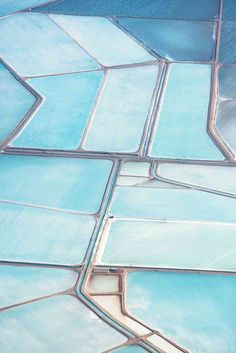 an aerial view of blue salt fields in australia, taken from the air with text overlay