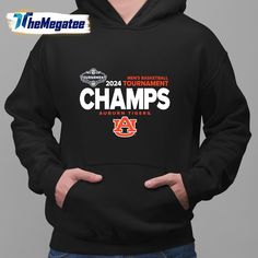 a man wearing a black hoodie with the words champs in orange and white on it