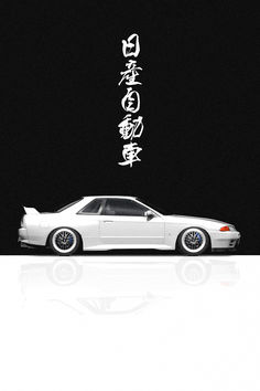 a white car parked in front of a black background with chinese characters on the side