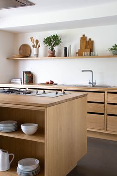 the kitchen is clean and ready to be used for cooking or dining purposes, as well as other things that are kept in the cupboards