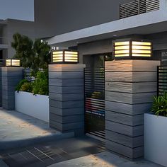 an outdoor area with planters and lights