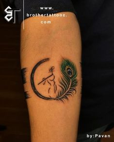 a tattoo with a peacock on the arm