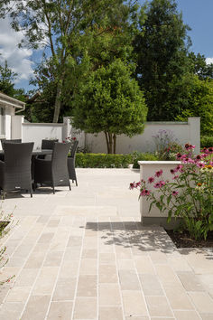 Beige natural stone tiles in an english country garden. Outdoor Limestone, Outdoor Pavers, Future Garden