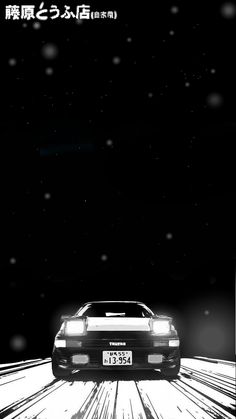 a black and white photo of a car in the snow