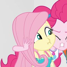 two pinkie ponies are standing next to each other