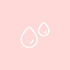 two drops of water on a pink background with the word love written in white ink