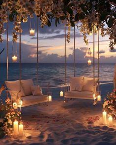 candles are lit on the beach as well as chairs and flowers in front of an ocean view