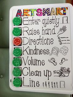 a white board with green and red markers on it that says arts & crafts center quality raise hand directions kindness volume clean up line