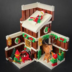 a lego christmas house is shown on a black background