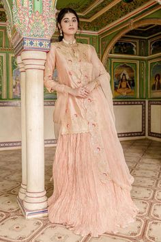 Peach kurta with all over marori floral embroidery and gota embellishments. Comes with can can attached lehenga and dupatta.
Components: 3
Pattern: Embroidered
Type Of Work: Thread, Gota, Marori
Neckline: Notched
Sleeve Type: Three quarter
Fabric: Lehenga and Kurta: Pure Spun Silk, Dupatta: Pure Organza
Color: Peach
Other Details: 
Attached lining
Approx. Product Weight: 2.50kg
Model Height: 5 ft 7 inches, wearing size S
Note: Only selling the product mentioned in description
Occasion: Sangeet,R Peach Lehenga, Kurta Lehenga, Silk Dupatta, Embroidered Silk, Set For Women, Aza Fashion, Model Height, Sleeve Type, Floral Embroidery