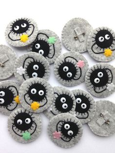 several black and white buttons with eyes on them