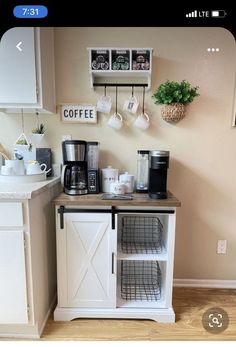 a small coffee bar in the corner of a kitchen