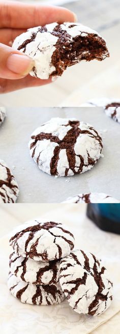 chocolate crinkle cookies with white powdered sugar on top are being held up by someone's hand