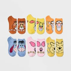 six pairs of cartoon character ankle socks in various colors and designs, all with faces on them