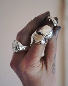 Chunky and delicious. I MASSIVE love heart for your finger. First carved from wax, then sandcast using 100% recycled silver. The heart ring is weighty but very comfortable. Perfect for an everyday statement Piece.  MADE FOR YOU: The dimensions of your ring will be individually modelled to suit your chosen ring size. The over all size of the heart will be based on the width of your finger and scaled appropriately. This design is intentionally heavy so no matter the ring size it will still have a Chunky Heart Ring, Heart-shaped Sterling Silver Engraved Signet Ring, Heart-shaped Engraved Sterling Silver Signet Ring, Chunky Silver Ring, Chunky Silver Jewellery, Chunky Silver Rings, Silver Heart Ring, Silver Signet Ring, Dope Jewelry