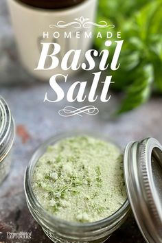 homemade basil salt in small jars next to a cup of coffee