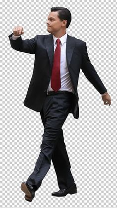 a man in a suit and tie is walking with his arms out to the side