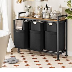 a bathroom with a sink, mirror and black storage bins on the counter top