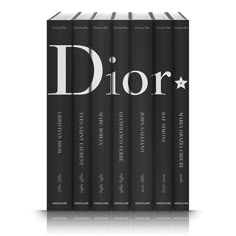 a set of four books with the title dior written in black and white on them