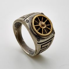 Sterling Silver signet ring set and soldered with double layered brass clock gear. Unisex. More Steampunk Jewelry : https://www.etsy.com/shop/galbarash?search_query=steampunk Back to my shop :  www.etsy.com/shop/galbarash More Signet rings :  www.etsy.com/shop/galbarash?ref=hdr_shop_menu&search_query=Signet More rings :  www.etsy.com/shop/galbarash?section_id=6176173 Handmade Made with nuts from the jewelry design studio of Gal Barash. All items are delivered in a special gift box. Silver & Brass Finish: Most of the jewelry and in particular the rings, which are worn exposed to the elements as they accompany you in life, will result in a unique individual color and surface finish. This depends on your habits and your skin and body acidity, so any finish you order: shiny clean or oxidized b Gear Ring, Cool Rings For Men, Clock Gears, Steampunk Rings, Jewelry Design Studio, Diamond Chain Necklace, Metalwork Jewelry, Signet Rings, Silver Signet Ring