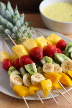 fruit kabobs on skewers with pineapples and strawberries