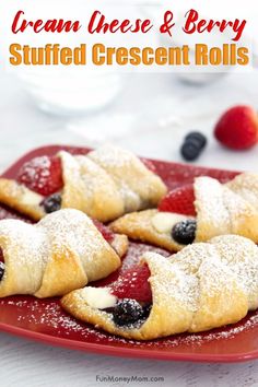 berry filled crescent pastries on a red plate