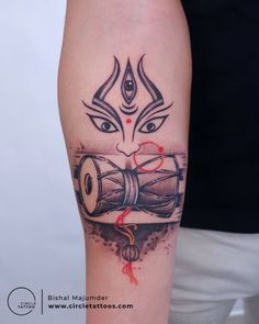 a person with a tattoo on their arm