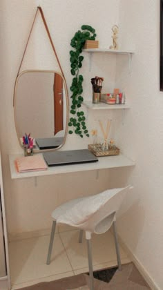 a white desk with a mirror and shelf on top of it in a room next to a door