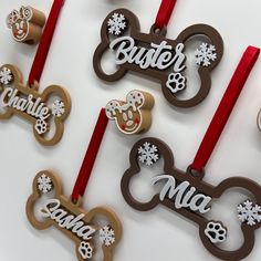 christmas ornament shaped like mickey mouses with name and dog bone on them