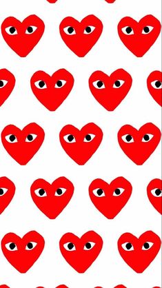 red hearts with black eyes on white background