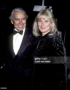 an older man and woman standing next to each other wearing tuxedos in formal wear